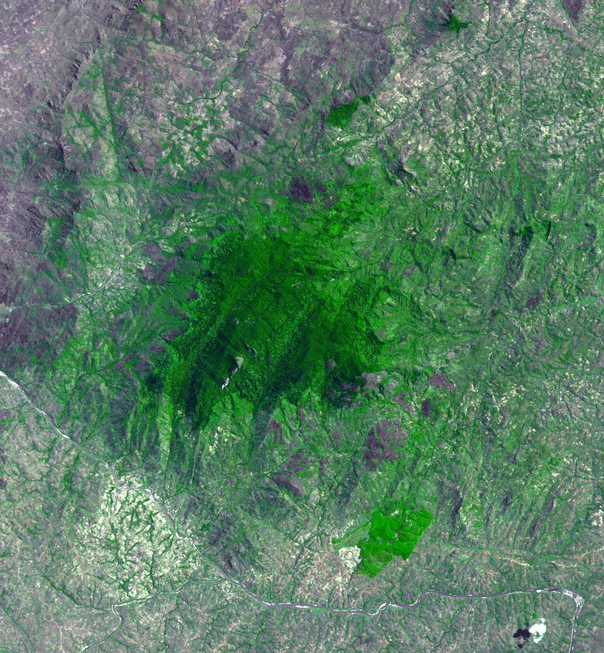 Mount Mabu in northern Mozambique is famous for its old-growth rain forest. The 75 square kilometers forest and its extremely diverse wildlife were unknown to scientists until 2005. One scientist believes he has discovered 15 new species of dung beetles. At least 25 additional new species of animals have also been found. The image was acquired October 4, 2023, covers an area of 26.7 by 28.8 km, and is located at 16.3 degrees south, 36.4 degrees east.  https://photojournal.jpl.nasa.gov/catalog/PIA26392