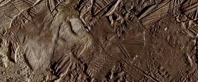 This image shows a close-up view of terrain within the region of Europa's surface named Conamara. This region sports ice rafts that look like those at Earth's poles, where large chunks of ice break away and float freely on the ocean. Much of the region bears the reddish/brownish discoloration seen here – the same as seen along many of Europa's fractures. Scientists believe this material may contain clues about the composition of an ocean beneath the icy surface, if it is proven to exist.  https://photojournal.jpl.nasa.gov/catalog/PIA26446