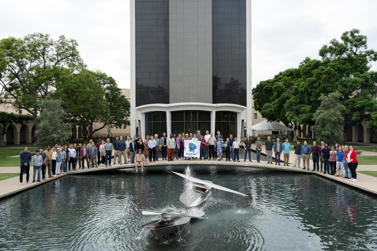 Members of the SPHEREx mission team pose for a photo on the campus of Caltech in Pasadena, California, in October 2023.  Short for Spectro-Photometer for the History of the Universe, Epoch of Reionization and Ices Explorer, SPHEREx will create a map of the cosmos like no other. Using a technique called spectroscopy to image the entire sky in 102 wavelengths of infrared light, SPHEREx will gather information about the composition of and distance to millions of galaxies and stars. With this map, scientists will study what happened in the first fraction of a second after the big bang, how galaxies formed and evolved, and the origins of water in planetary systems in our galaxy.  https://photojournal.jpl.nasa.gov/catalog/PIA26534