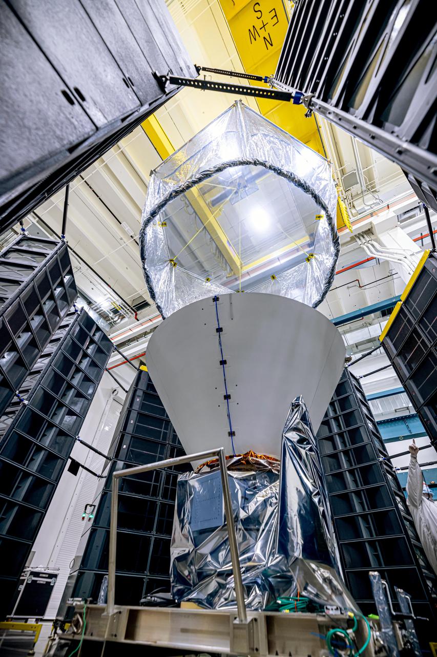 NASA's SPHEREx observatory is installed in the Fiesta Area at BAE Systems in Boulder, Colorado, in July 2024. The observatory is surrounded by speaker stacks used to perform acoustics testing, which subjects the spacecraft to the acoustics loads that it will experience during launch.  Short for Spectro-Photometer for the History of the Universe, Epoch of Reionization and Ices Explorer, SPHEREx will create a map of the cosmos like no other. Using a technique called spectroscopy to image the entire sky in 102 wavelengths of infrared light, SPHEREx will gather information about the composition of and distance to millions of galaxies and stars. With this map, scientists will study what happened in the first fraction of a second after the big bang, how galaxies formed and evolved, and the origins of water in planetary systems in our galaxy.  https://photojournal.jpl.nasa.gov/catalog/PIA26540