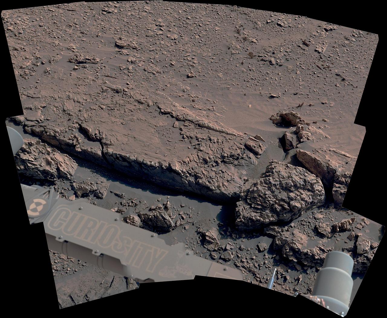 The curblike ridge in this view is part of a series of crisscrossing features that form what's called a boxwork pattern. NASA's Curiosity Mars rover captured the image with its Mast Camera, or Mastcam, on May 16, 2025, the 4,541st Martian day, or sol, of the mission. This panorama was stitched together from 15 individual images. The color in these images has been adjusted to match the lighting conditions as the human eye would see them on Earth. When viewed from space, the boxwork patterns look a bit like spiderwebs. They have fascinated scientists since before Curiosity's 2012 landing on the Red Planet and are believed to have formed from groundwater trickling through rock cracks billions of years ago. Minerals left behind by the water hardened like cement within the rock; after eons of sandblasting by wind, the rock was carved away, revealing networks of resistant ridges within. https://photojournal.jpl.nasa.gov/catalog/PIA26558