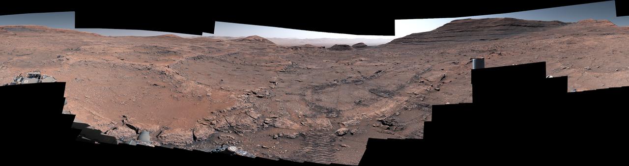 NASA's Curiosity Mars rover captured this 360-degree view after arriving at a region crisscrossed by hardened low ridges called boxwork patterns. The panorama is stitched together from 291 individual images the rover's Mast Camera, or Mastcam, captured between May 15 and May 18, 2025 (the 4,451st Martian day, or sol, of the mission and the 4,454th sol). The color in these images has been adjusted to match the lighting conditions as the human eye would see them on Earth. When viewed from space, the boxwork patterns look a bit like spiderwebs. They have fascinated scientists since before Curiosity's 2012 landing on the Red Planet and are believed to have formed from groundwater trickling through rock cracks billions of years ago. Minerals left behind by the water hardened like cement within the rock; after eons of sandblasting by wind, the rock was carved away, revealing networks of resistant ridges within. Curiosity's tracks can be seen in the middle of the image. In the distance to the right is a butte nicknamed "Texoli." Far in the distance at the top center of the image is the rim of Gale Crater. Since 2014, Curiosity has been exploring the foothills of Mount Sharp, a 3-mile-tall (5-kilometer-tall) mountain within the crater. https://photojournal.jpl.nasa.gov/catalog/PIA26559