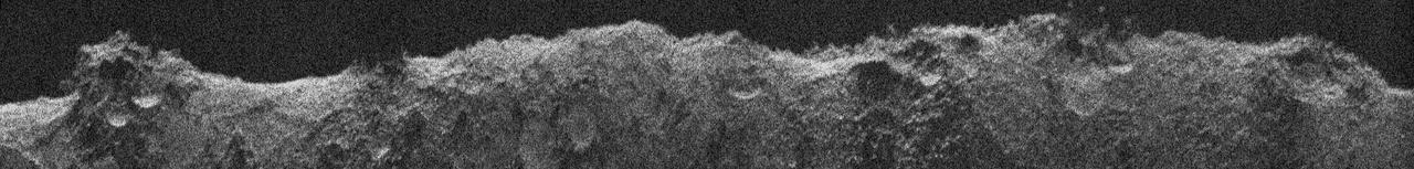 NASA's Europa Clipper, en route to the Jupiter system to investigate the icy moon Europa, conducted a critical test of its radar instrument during a flyby of Mars on March 1, 2025. During the testing, the instrument received echoes of its very-high-frequency radar signals that engineers processed to develop this image, called a radargram.  The image was made using radar signals that bounced off Mars. What looks like a skyline is the outline of the topography. Features seen in the radargram include contributions from the topographic features both along and near the ground track (the path below the spacecraft as it passed overhead), such as impact craters, hills, and steep slopes. The 560-mile-long (900-kilometer-long) section of terrain profiled in this radargram is near Mars' equator.  The Europa Clipper radar instrument, REASON (Radar for Europa Assessment and Sounding: Ocean to Near-surface), is designed to see into the icy crust of Europa. Though the rocky Martian surface does not allow much penetration by the radar signals, the clarity of the radargram image indicates REASON was performing as expected during the Mars flyby, boding well for future observations at Europa.  As Europa Clipper zipped by the Red Planet – starting at 3,100 miles (5,000 kilometers) down to 550 miles (884 kilometers) above the surface – REASON sent and received radio waves for about 40 minutes. In comparison, at Europa the instrument will operate as close as 16 miles (25 kilometers) from the moon's surface.  Europa Clipper launched from NASA's Kennedy Space Center in Florida on Oct. 14, 2024, and will arrive at the Jupiter system in 2030 to conduct about 50 flybys of Europa. The mission's main science goal is to determine whether there are places below Europa's surface that could support life. The mission's three main science objectives are to determine the thickness of the moon's icy shell and its surface interactions with the ocean below, to investigate its composition, and to characterize its geology. The mission's detailed exploration of Europa will help scientists better understand the astrobiological potential for habitable worlds beyond our planet.  https://photojournal.jpl.nasa.gov/catalog/PIA26568