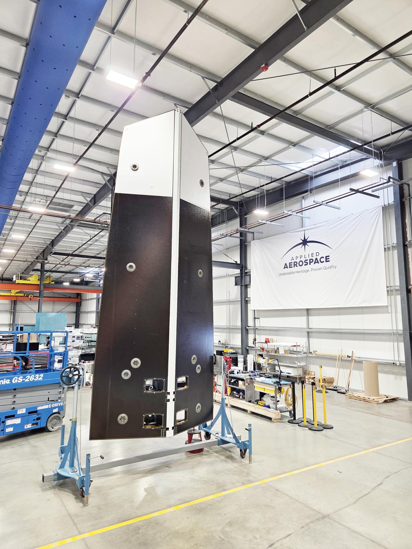 The sunshade for NASA’s Near-Earth Object (NEO) Surveyor mission towers above a fixture at supplier Applied Aerospace in Stockton, California, in September 2025.