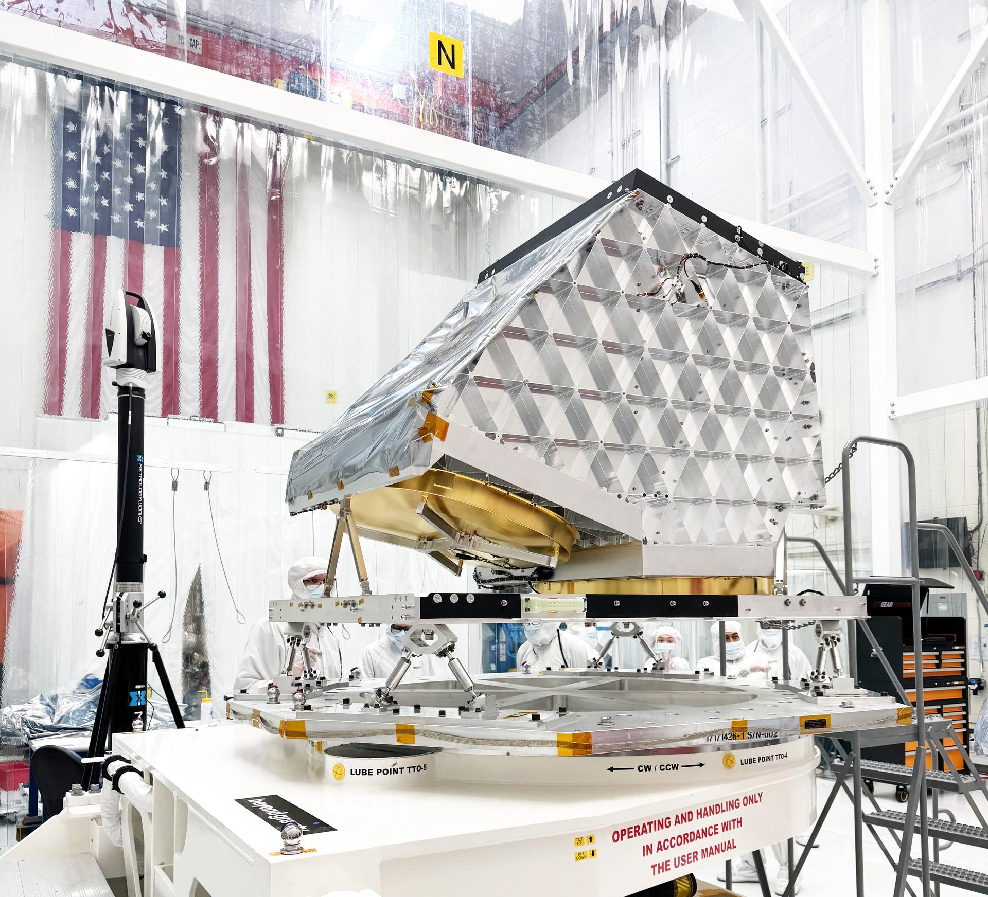 The aluminum telescope of NASA’s Near-Earth Object (NEO) Surveyor mission is shown here attached its flight base frame at a Space Dynamics Laboratory (SDL) clean room in Logan, Utah, in early September 2025. The telescope is connected via a system of struts that prevent heat from passing from the spacecraft to the instrument, keeping it secure, isolated, and cool. The spacecraft’s instrument enclosure will later be fitted over the instrumentation and then the pair will be attached to the spacecraft bus and sunshade.  With an aperture of nearly 20 inches (50 centimeters), the telescope features detectors sensitive to two infrared wavelengths in which near-Earth objects re-radiate solar heat. The instrument enclosure is designed to ensure heat produced by the spacecraft and instrument during operations doesn’t interfere with its infrared observations.  Targeting launch in late 2027, the NEO Surveyor mission is led by Professor Amy Mainzer at the University of California, Los Angeles for NASA’s Planetary Defense Coordination Office and is being managed by the agency’s Jet Propulsion Laboratory in Southern California for the Planetary Missions Program Office at NASA’s Marshall Space Flight Center in Huntsville, Alabama. BAE Systems and the Space Dynamics Laboratory in Logan, Utah, and Teledyne are among the companies that were contracted to build the spacecraft and its instrumentation. The Laboratory for Atmospheric and Space Physics at the University of Colorado Boulder will support operations, and IPAC at Caltech in Pasadena, California, is responsible for producing some of the mission’s data products. Caltech manages JPL for NASA.  More information about NEO Surveyor is available at:  https://science.nasa.gov/mission/neo-surveyor/ 