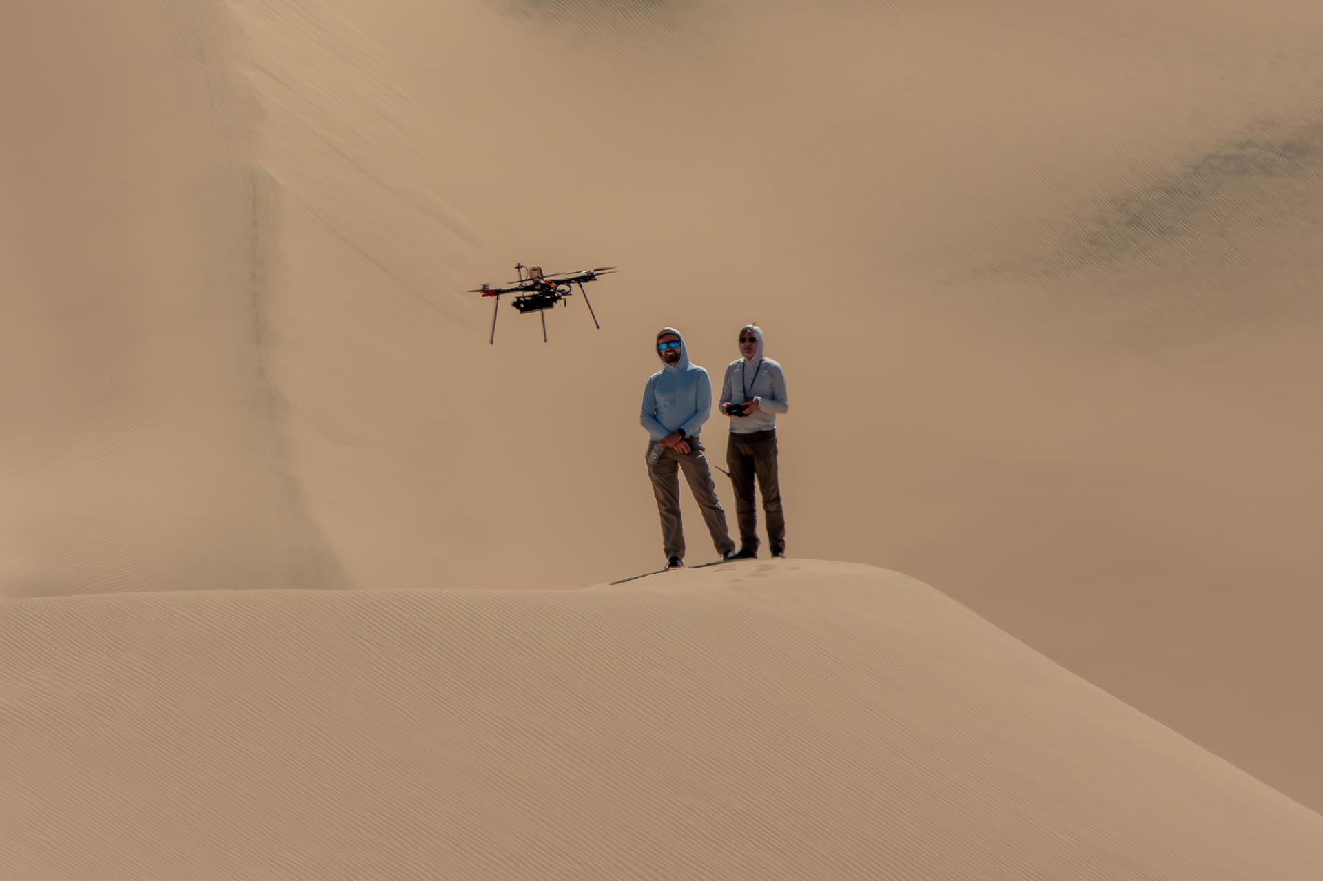 Researchers from NASA’s Jet Propulsion Laboratory in Southern California monitor a research drone in the Dumont Dunes area of the Mojave Desert in September as part of a test campaign to develop navigation software to guide future rotorcraft on Mars.