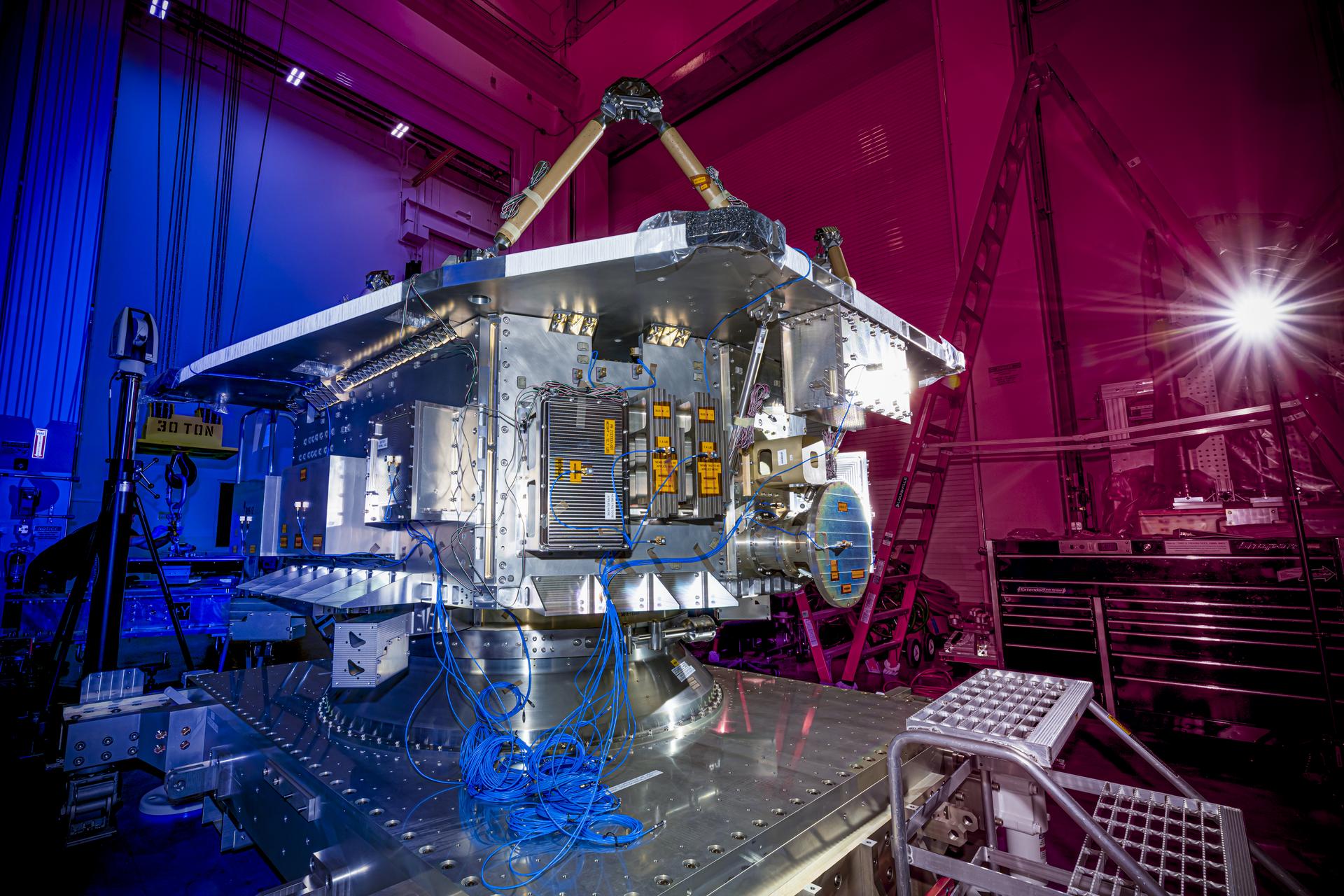 The bus structure of the Near-Earth Object (NEO) Surveyor spacecraft underwent testing at BAE Systems Space & Mission Systems in Boulder, Colorado, in August 2025. NEO Surveyor’s bus houses the power, propulsion, avionics, and communication subsystems, which are isolated from the spacecraft’s telescope and sensitive detectors. When all components are assembled, a large sunshade will be attached to the side of the bus, blocking the Sun’s glare from entering the telescope.  With an aperture of nearly 20 inches (50 centimeters), the telescope features detectors sensitive to two infrared wavelengths in which near-Earth objects re-radiate solar heat. The instrument enclosure is designed to ensure heat produced by the spacecraft and instrument during operations doesn’t interfere with its infrared observations.   Targeting launch in late 2027, the NEO Surveyor mission is led by Professor Amy Mainzer at the University of California, Los Angeles for NASA’s Planetary Defense Coordination Office and is being managed by the agency’s Jet Propulsion Laboratory in Southern California for the Planetary Missions Program Office at NASA’s Marshall Space Flight Center in Huntsville, Alabama. BAE Systems Space & Mission Systems and the Space Dynamics Laboratory in Logan, Utah, and Teledyne are among the companies that were contracted to build the spacecraft and its instrumentation. The Laboratory for Atmospheric and Space Physics at the University of Colorado Boulder will support operations, and IPAC at Caltech in Pasadena, California, is responsible for producing some of the mission’s data products. Caltech manages JPL for NASA.   More information about NEO Surveyor is available at:   https://science.nasa.gov/mission/neo-surveyor/ 