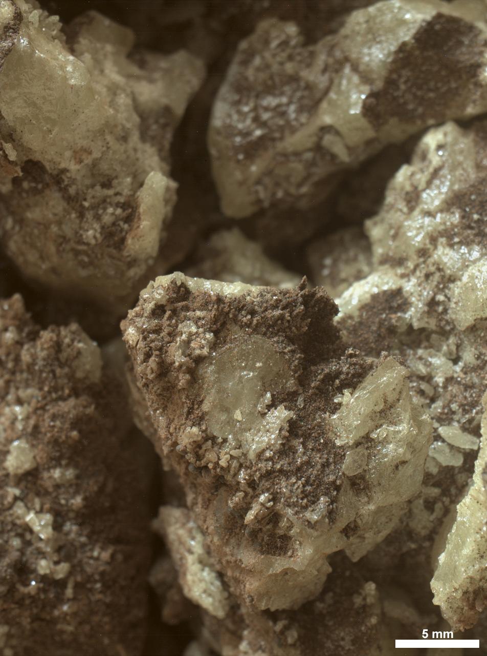 These sulfur crystals were found inside a rock after NASA’s Curiosity Mars rover happened to drive over it and crush it on May 30, 2024, the 4,200th Martian day, or sol, of the mission. The image was captured by Curiosity’s Mars Hand Lens Imager (MAHLI), a camera on the end of its robotic arm, on June 4, 2024, Sol 4,205. This rock was nicknamed “Convict Lake” after a location in California’s Sierra Nevada. Curiosity’s Alpha Particle X-Ray Spectrometer (APXS) found that the crystalline material is elemental sulfur. Curiosity was built by NASA’s Jet Propulsion Laboratory, which is managed by Caltech in Pasadena, California. JPL leads the mission on behalf of NASA’s Science Mission Directorate in Washington. MAHLI was built by Malin Space Science Systems in San Diego. For more about Curiosity, visit: https://science.nasa.gov/mission/msl-curiosity.