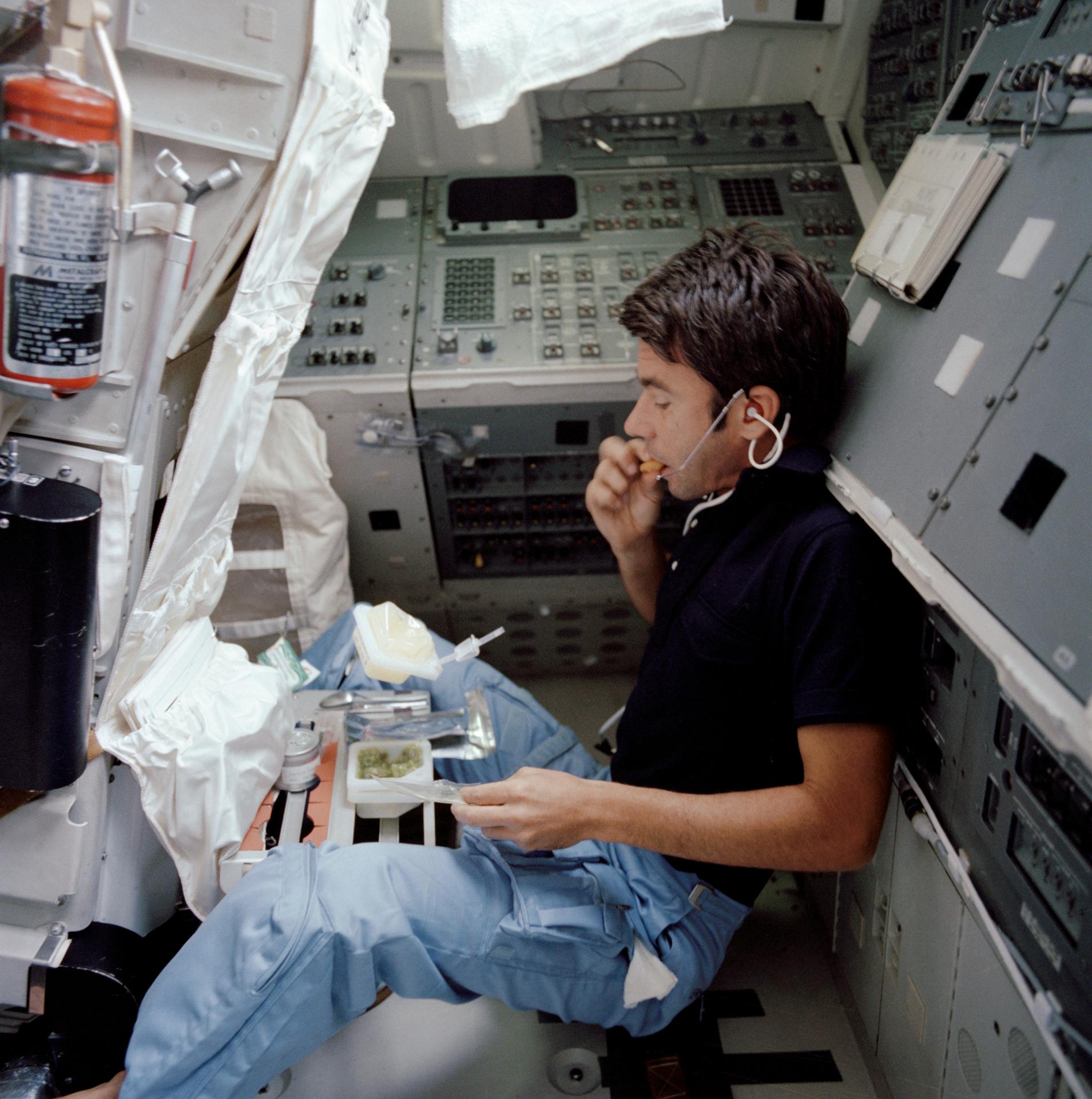 Astronaut William B. Lenoir eating a meal on Space Shuttle Columbia.