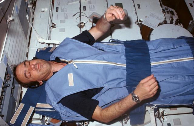 NASA image: Mission Specialist (MS) Fabian sleeps on middeck