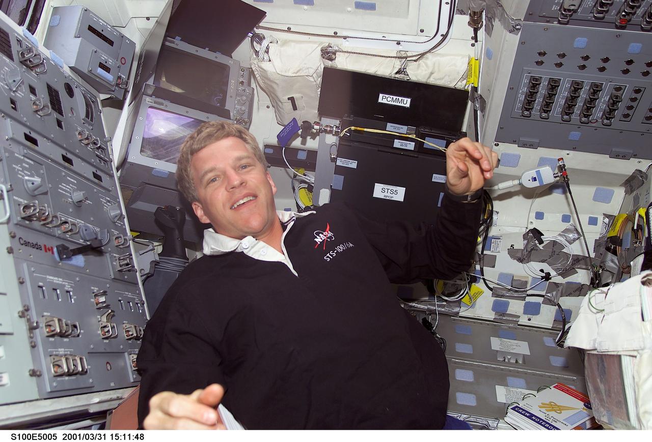 S100-E-5005 (20 April 2001)--- Astronaut Scott E. Parazynski, mission specialist for STS-100, is pictured on the aft flight deck of the Space Shuttle Endeavour as the shuttle steadily makes its way toward the International Space Station (ISS) following an April 19 launch. Part of Parazynski's training has been geared toward preparing him for scheduled extravehicular activity (EVA) later in the mission. This image was recorded by a fellow crew member using a digital still camera.