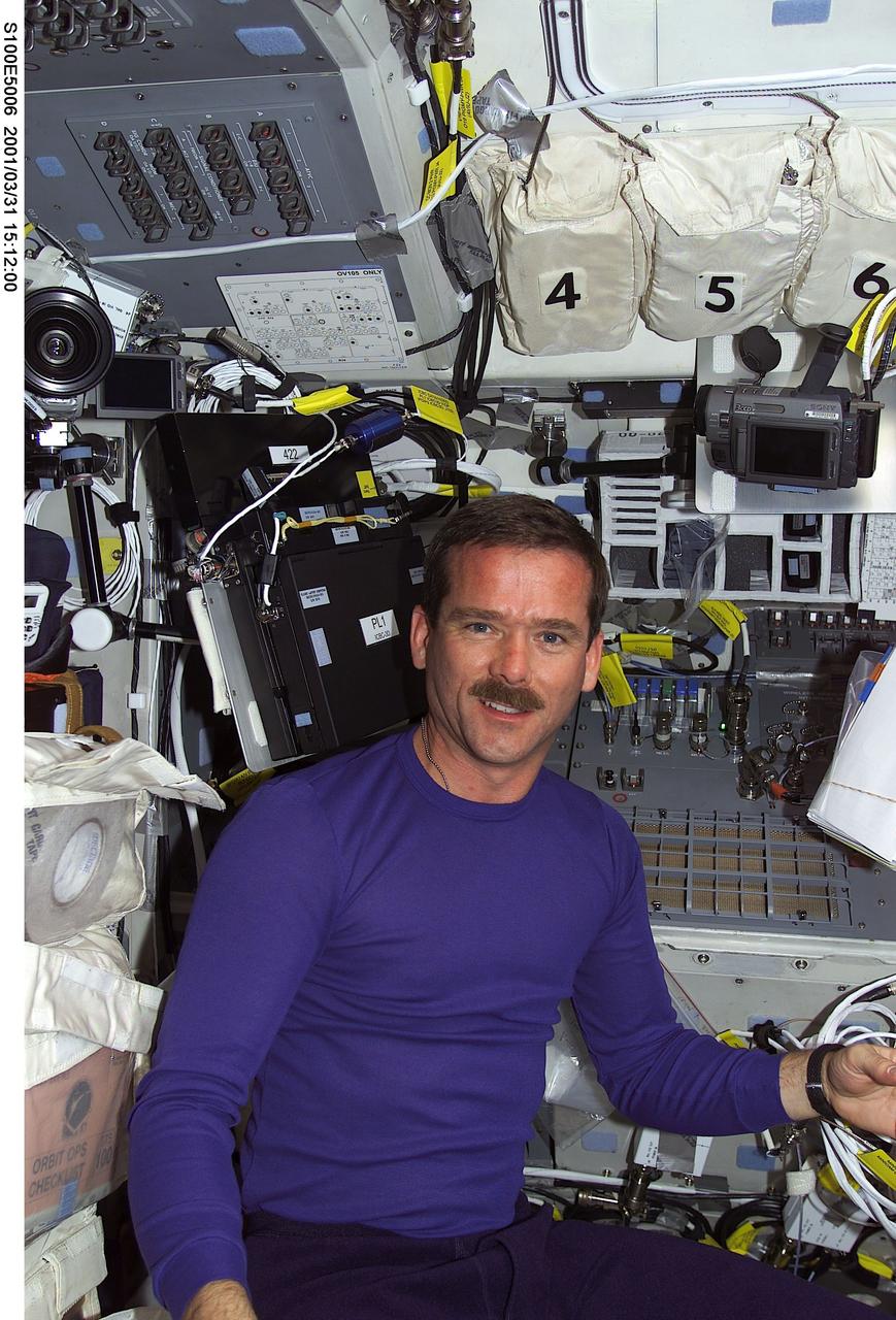 S100-E-5006 (20 April 2001) --- Astronaut Chris A. Hadfield, representing the Canadian Space Agency (CSA), is pictured on Endeavour's flight deck as the shuttle steadily makes its way toward the International Space Station (ISS) following an April 19 launch. Part of Hadfield's training has been geared toward preparing him for scheduled extravehicular activity (EVA) later in the mission. This image was recorded by a fellow crew member using a digital still camera.
