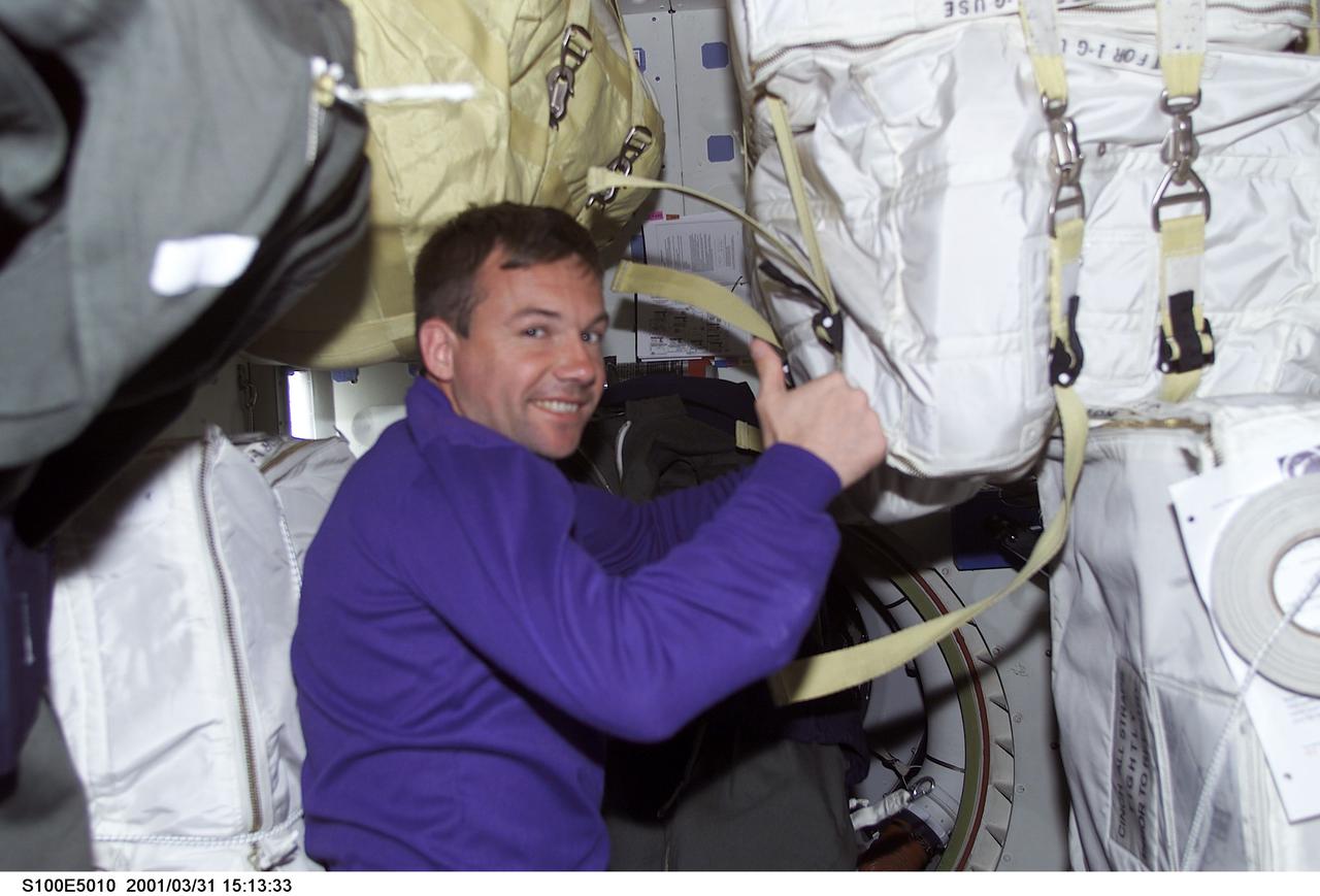 S100-E-5010 (20 April 2001) --- Cosmonaut Yuri V. Lonchakov of Rosaviakosmos gives a thumbs-up sign on the middeck of the Space Shuttle Endeavour as it steadily moves toward the International Space Station (ISS). The picture was taken with a digital still camera.