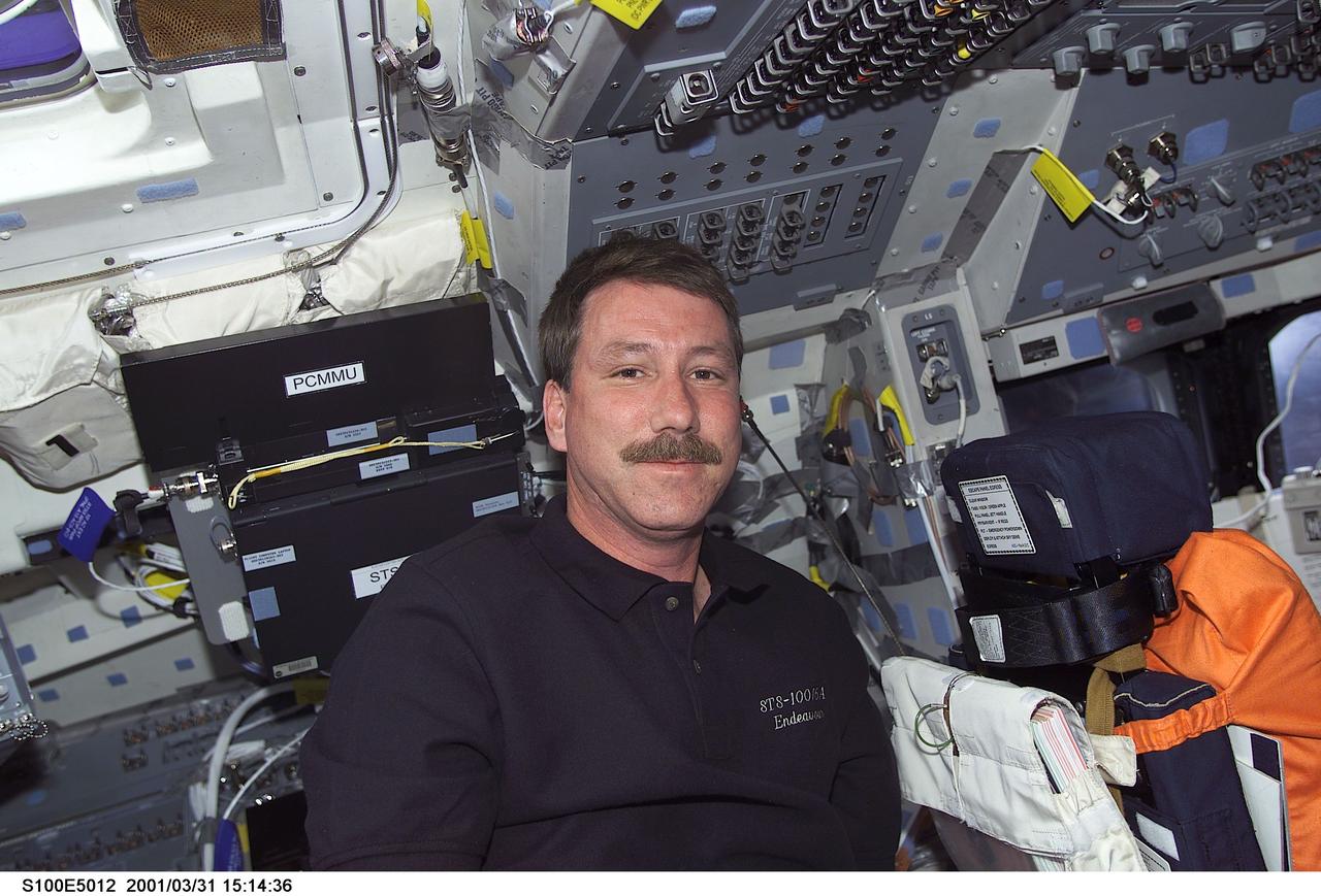 S100-E-5012 (20 April 2001)--- Astronaut Kent V. Rominger, mission commander for STS-100, is pictured on the aft flight deck of the Space Shuttle Endeavour as the shuttle steadily makes its way toward the International Space Station (ISS) following an April 19 launch. This image was recorded by a fellow crew member using a digital still camera.
