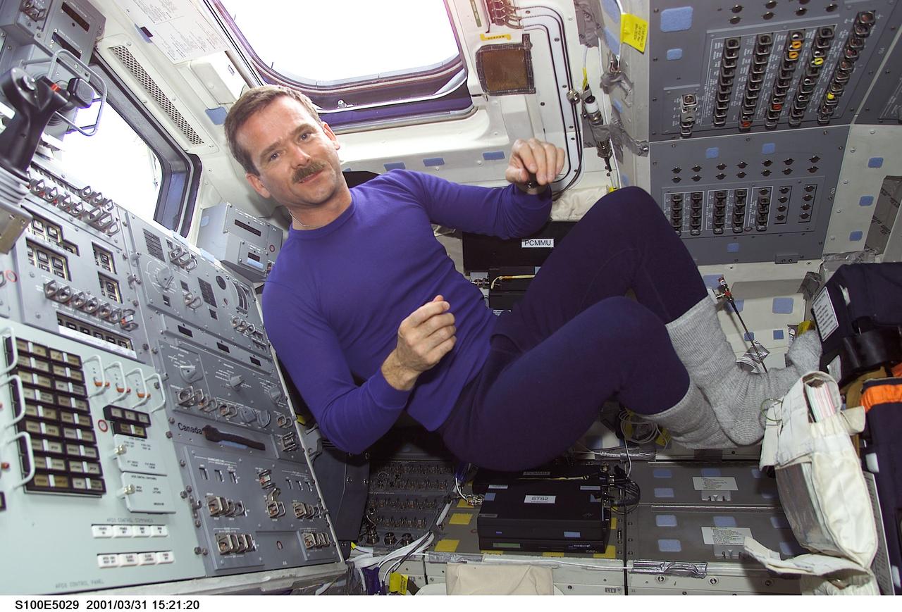 S100-E-5029 (20 April 2001) --- Astronaut Chris A. Hadfield, representing the Canadian Space Agency (CSA), is pictured on Endeavour's flight deck as the shuttle steadily makes its way toward the International Space Station (ISS) following an April 19 launch. Part of Hadfield's training has been geared toward preparing him for scheduled extravehicular activity (EVA) later in the mission. This image was recorded by a fellow crew member using a digital still camera.