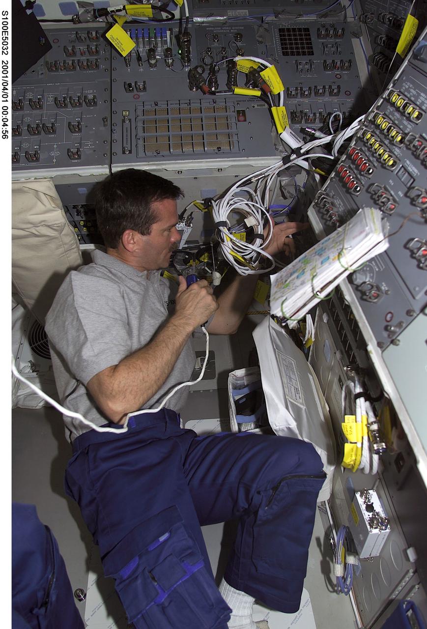 S100-E-5032 (20 April 2001) --- Astronaut Chris A. Hadfield, representing the Canadian Space Agency (CSA), is pictured on Endeavour's flight deck as the shuttle steadily makes its way toward the International Space Station (ISS) following an April 19 launch. Hadfield is checking out rendezvous and communications gear in preparation for an April 21 docking with the station. This image was recorded by a fellow crew member using a digital still camera.