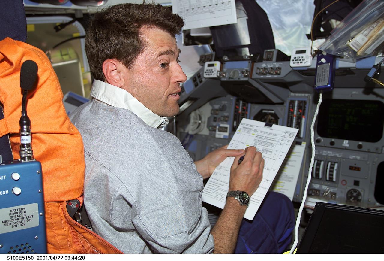 S100-E-5150 (21 April 2001) --- Astronaut Jeffrey S. Ashby, pilot, temporarily occupies the commander's station for a task on the flight deck of the Space Shuttle Endeavour as the seven-member crew prepares for its union with the International Space Station (ISS). The photo was recorded with a digital still camera.