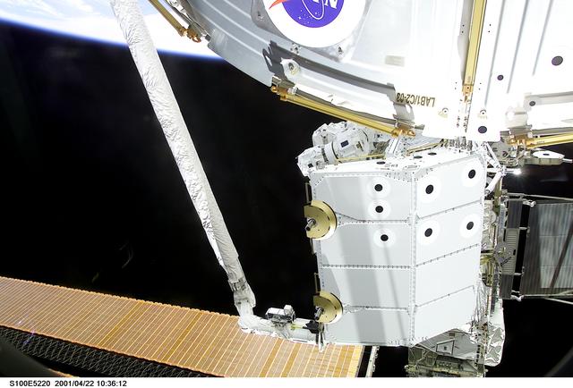 NASA image: View of the RMS grappling the Spacelab Pallet during STS-100