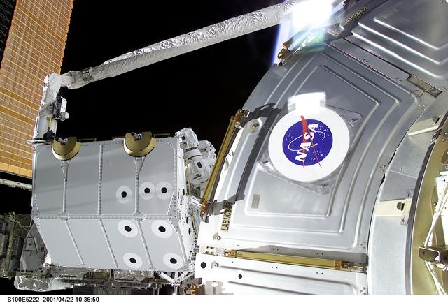 NASA image: View of the RMS grappling the Spacelab Pallet during STS-100