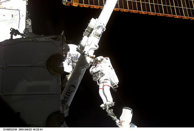 NASA image: MS Hadfield works on the SSRMS in the SLP during the first EVA for STS-100