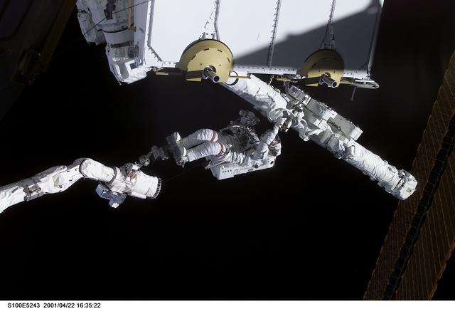 NASA image: MS Hadfield works on the SSRMS in the SLP during the first EVA for STS-100