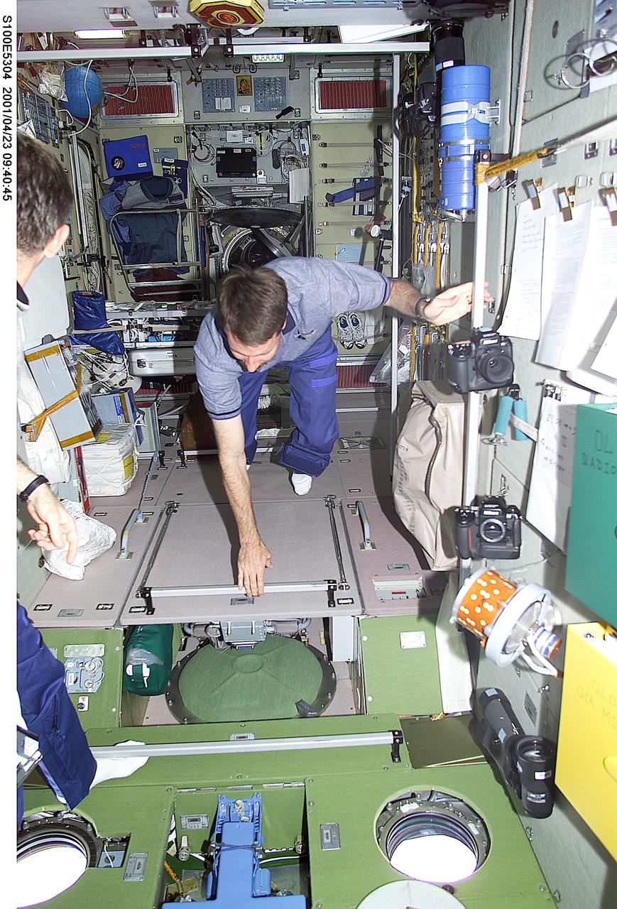 S100-E-5304 (23 April 2001) --- Astronaut Kent V. Rominger, STS-100 mission commander, tours the Zvezda Service Module on the International Space Station (ISS) not long after the seven-member STS-100 crew went aboard the orbital outpost and reunited with the station's second crew. The image was recorded with a digital still camera.