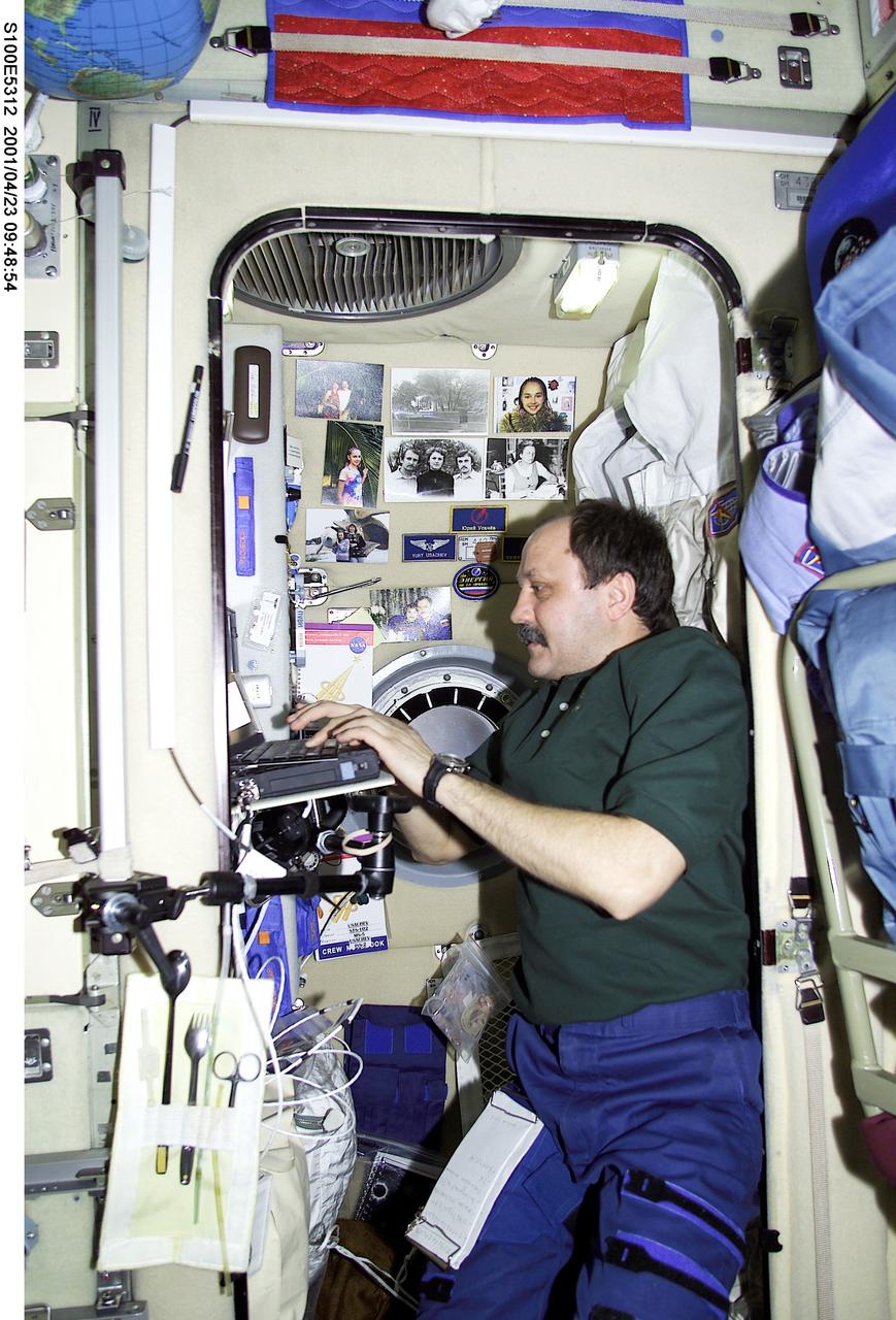S100-E-5312 (23 April 2001) --- Astronaut Kent V. Rominger, STS-100 mission commander, tours the Zvezda Service Module on the International Space Station (ISS) not long after the seven-member STS-100 crew went aboard the orbital outpost and reunited with the station's second crew. The image was recorded with a digital still camera.
