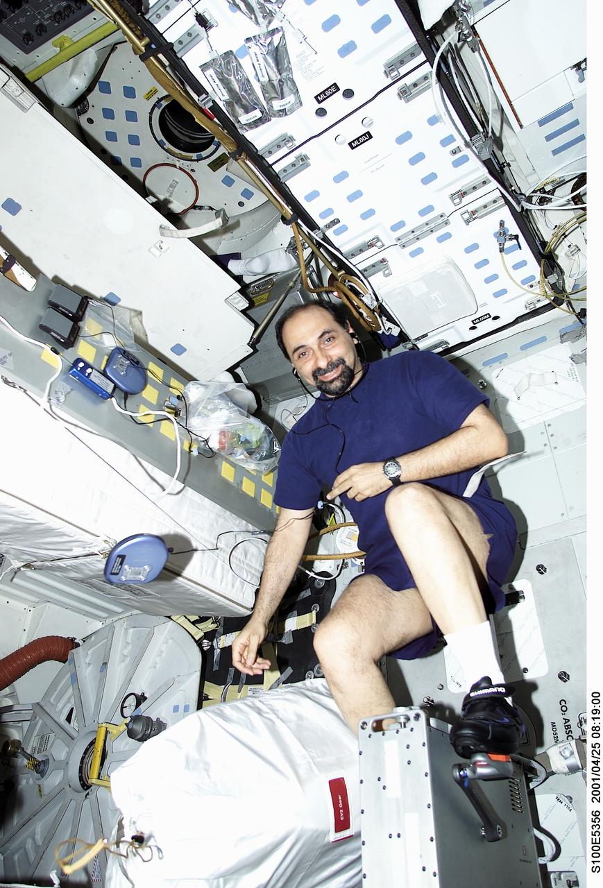 S100-E-5356 (25 April 2001) --- Astronaut Umberto Guidoni, STS-100 mission specialist representing the European Space Agency (ESA), works out on a bicycle ergometer on the middeck of the Space Shuttle Endeavour.