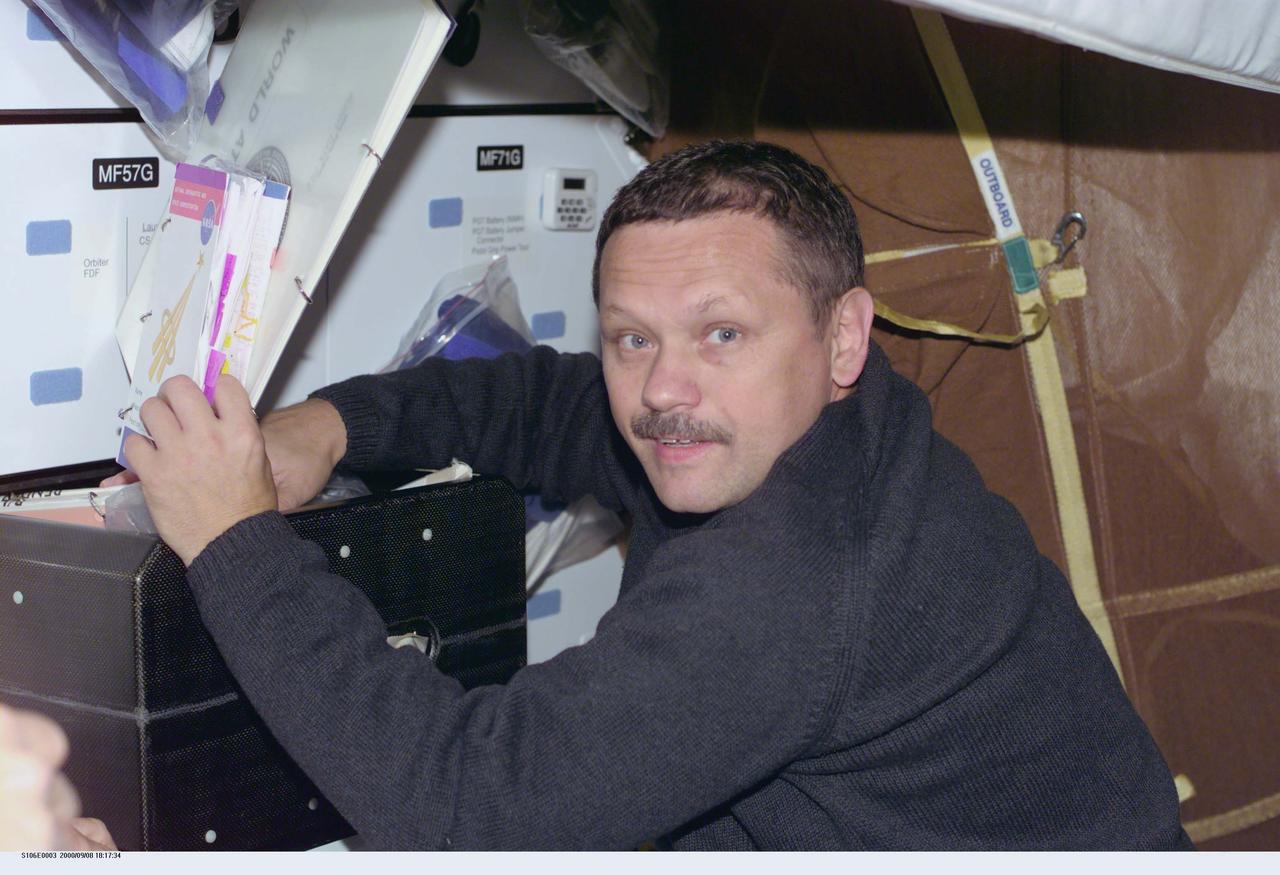 STS106-E-5003 (8 September 2000) --- Cosmonaut Boris V. Morukov, mission specialist representing the Russian Aviation and Space Agency,  begins to organize affairs during Flight Day 1 onboard the Earth-orbiting Space Shuttle Atlantis.