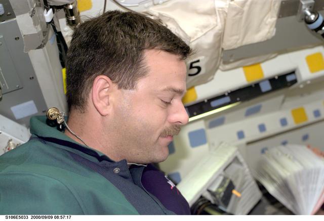 NASA image: Pilot Altman at work aboard Atlantis during STS-106