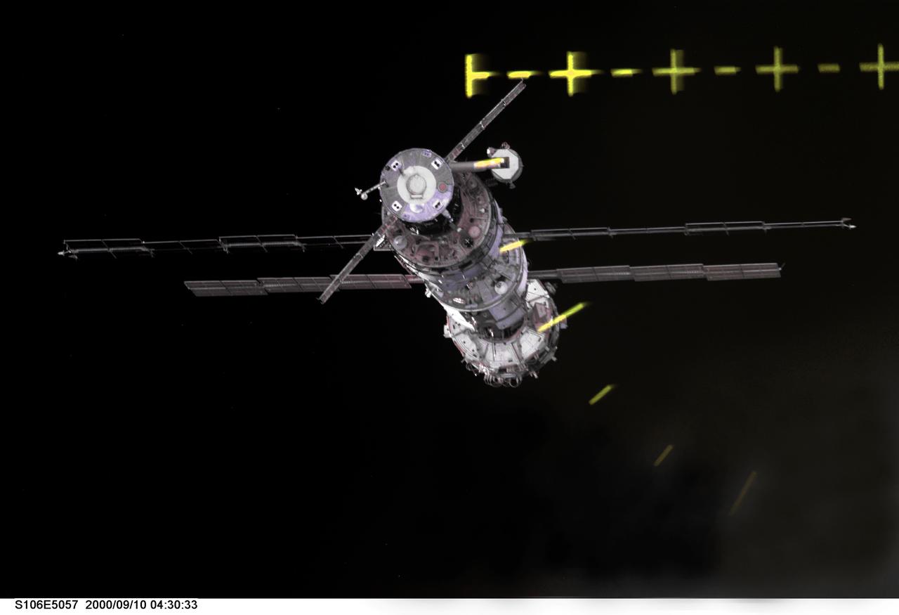 S106-E-5057 (10 September 2000) --- The International Space Station (ISS) is only a few hundred meters away from the Space Shuttle Atlantis in this electronic image.  The last time astronauts saw the ISS, it was not sporting the recently-arriving Progress, which appears at the top in this perspective. Also, next to the Progress, appears the Zvezda service module, which had been delivered by a Proton rocket since the most recent human visit to ISS. The ruled markings in the upper right are part of the Crew Optical Alignment Sight (COAS) on Atlantis.
