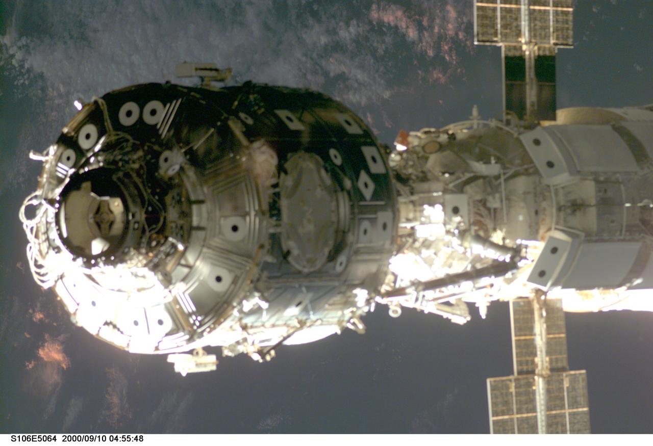 S106-E-5064 (10 September 2000) --- The U.S.-built Unity node and part of the Russian-built Zarya or functional cargo block (FGB) are featured in this electronic still camera's (ESC) view, recorded during rendezvous operations by the Space Shuttle Atlantis. The Zvezda service module and a Progress supply vehicle are out of frame at right.
