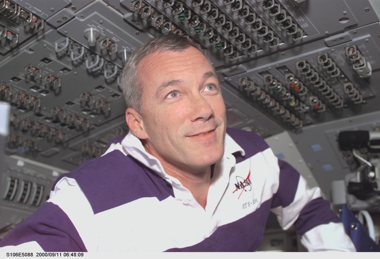 S106-E-5088 (11 September 2000) --- Astronaut Terrence W. Wilcutt, mission commander, on the flight deck of the Space Shuttle Atlantis during Flight Day 3 activity.
