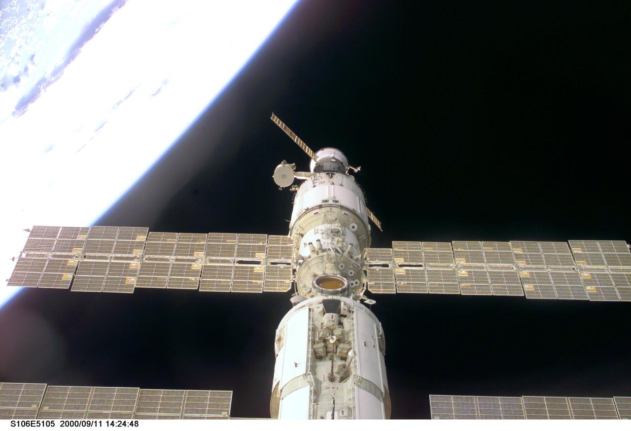 S106-E-5105 (11 September 2000) --- This view of the International Space Station (ISS) was taken while it was docked with the Space Shuttle Atlantis and shows parts of all but one of the current components. From the top are the Progress supply vehicle, the Zvezda service module, and the Zarya functional cargo block (FGB). The Unity, now linked to the docking system of the Atlantis in the cargo bay, is out of view at bottom.