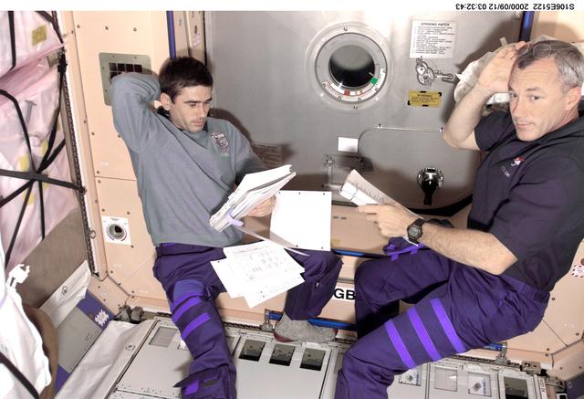 NASA image: Commander Wilcutt and MS Malenchenko working in Node 1 during STS-106