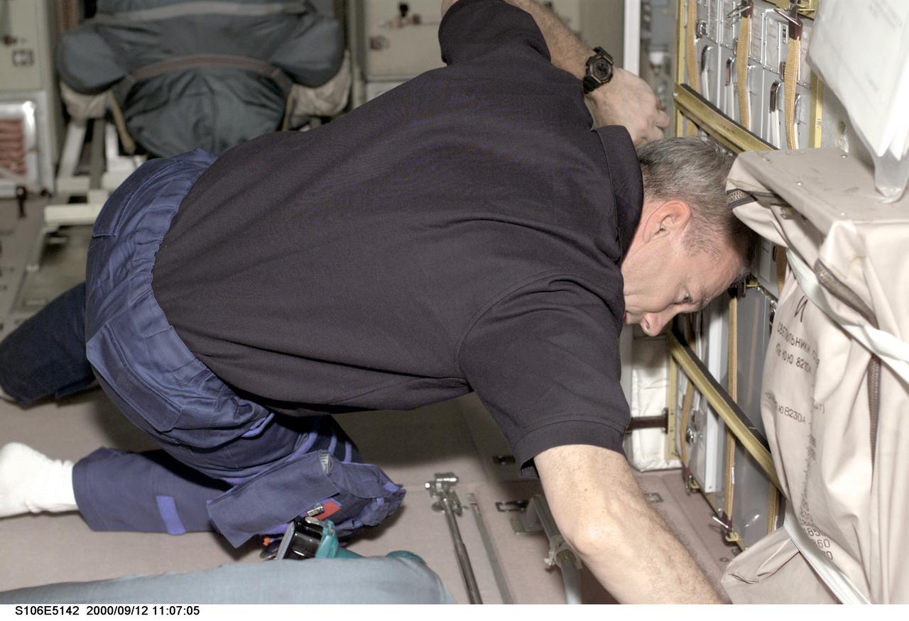 STS106-E-5142 (12 September 2000) ---  Astronaut Terrence W. Wilcutt, mission commander, works to prepare the interior of the Zvezda service module on the International Space Station (ISS) for   astronauts and cosmonauts who will soon start to live there.