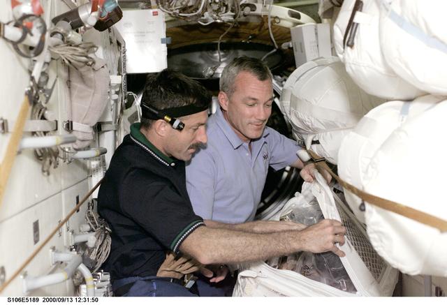 NASA image: Commander Wilcutt and MS Burbank work on Zvezda during STS-106