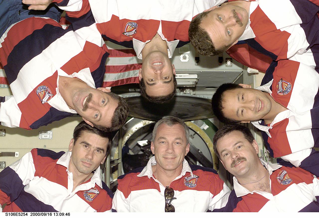 S106-E-5254 (16 September 2000) --- A brief break during busy moving tasks and detail work afforded the STS-106 crew members an opportunity for another traditional inflight crew portrait, snapped by a pre-set electronic still camera (ESC) nearby.  Astronaut Terrence W. Wilcutt, mission commander, is at bottom center. Counterclockwise from that point are cosmonaut Yuri I. Malenchenko, astronauts Daniel C. Burbank and Richard A. Mastracchio, cosmonaut Boris V. Morukov and astronaut Edward T. Lu, all mission specialists; along with astronaut Scott D. Altman, pilot. Malenchenko and Morukov represent the Russian Aviation and Space Agency.