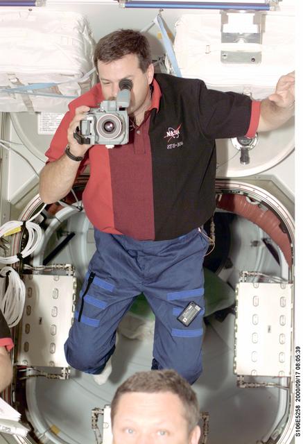 NASA image: Pilot Altman documents the final closeout of Zvezda during STS-106