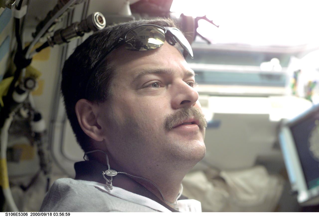 S106-E-5306 (18 September 2000) --- Astronaut Scott D. Altman, pilot, occupies the commander's station for some important maneuvers. Atlantis&#0146; seven astronauts and cosmonauts successfully undocked from the International Space Station after accomplishing all mission objectives in outfitting the station for the first resident crew. Undocking occurred at 3:46 GMT, Sept. 18, over Russia near the northeastern portion of Ukraine. When Atlantis was at a safe distance from the station, about 450 feet,  Altman performed a 90-minute, double-loop fly around to enable the crew to document the station&#0146;s exterior.  He fired Atlantis&#0146; jets one final time to separate from the station at 5:35 GMT, September 18.