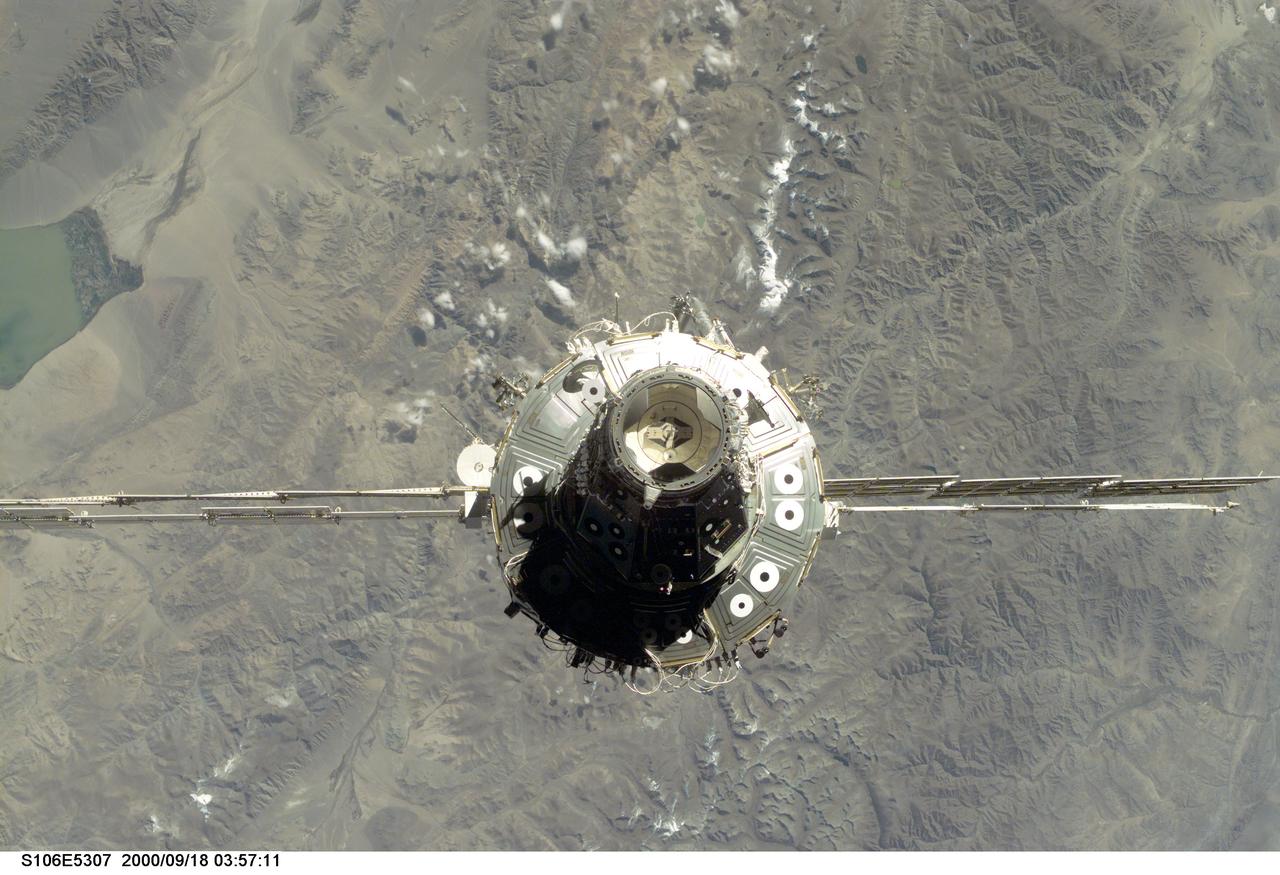 S106-E-5307 (18 September 2000) --- The International Space Station (ISS), with its U.S.-built Unity node facing the camera, is seen following its undocking with the Space Shuttle Atlantis. After accomplishing all mission objectives in outfitting the station for the first resident crew, the seven astronauts and cosmonauts undocked at 3:46 (GMT) on Sept. 18 over Russia near the northeastern portion of Ukraine. When Atlantis was at a safe distance from the station, about 450 feet, astronaut Scott D. Altman, pilot, performed a 90-minute, double-loop fly around to enable the crew to document the station’s exterior. He fired Atlantis’ jets one final time to separate from the station at 5:35 GMT, September 18.
