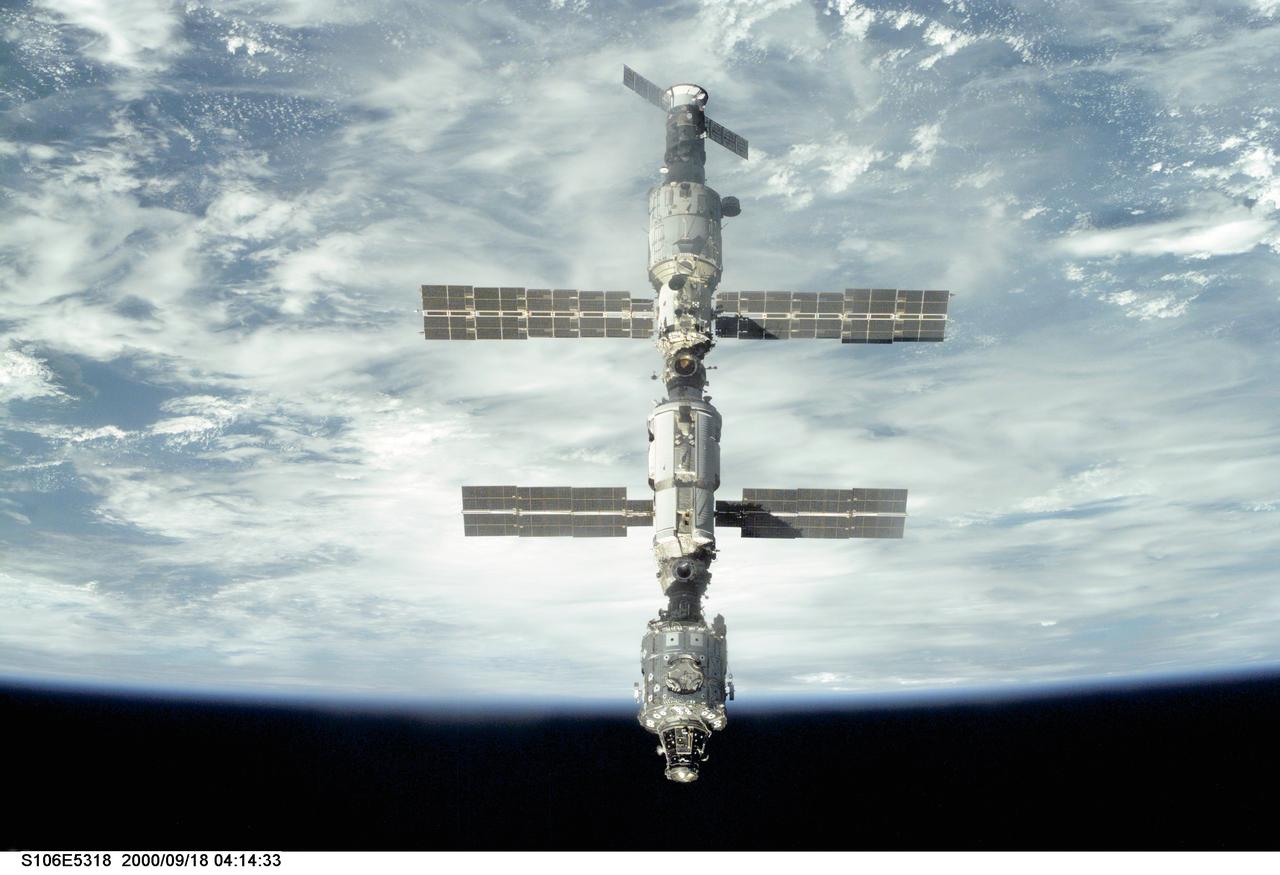 S106-E-5318 (18 September 2000) --- Backdropped against Earth's horizon, the International Space Station (ISS) is seen following its undocking with the Space Shuttle Atlantis. After accomplishing all mission objectives in outfitting the station for the first resident crew, the seven astronauts and cosmonauts undocked at 3:46 GMT on Sept. 18 over Russia near the northeastern portion of Ukraine. When Atlantis was at a safe distance from the station, about 450 feet, astronaut Scott D. Altman, pilot, performed a 90-minute, double-loop fly around to enable the crew to document the station’s exterior. He fired Atlantis’ jets one final time to separate from the station at 5:35 (GMT) September 18.