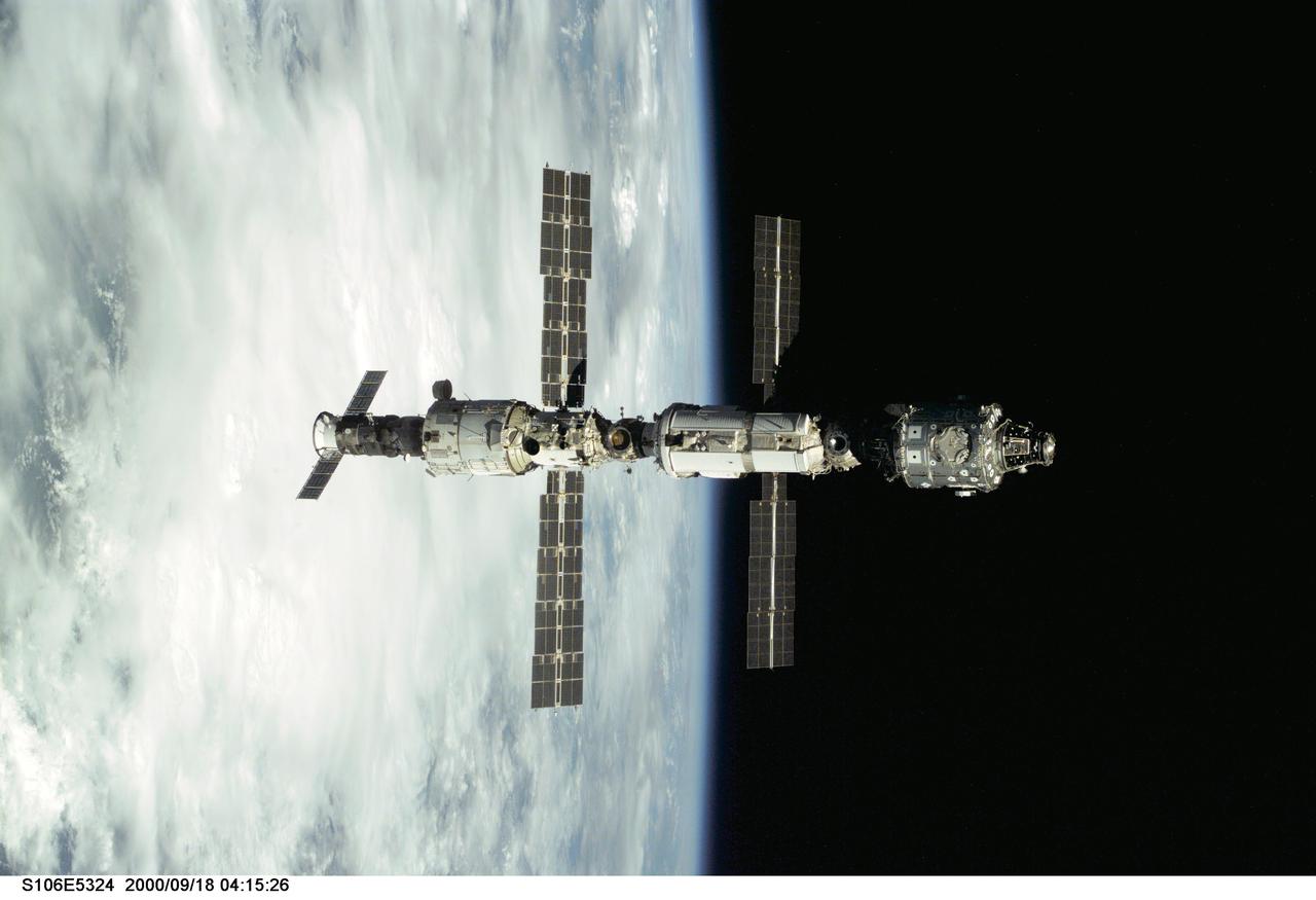 S106-E-5324 (18 September 2000) --- Backdropped against Earth's horizon, the International Space Station (ISS) is seen following its undocking with the Space Shuttle Atlantis. After accomplishing all mission objectives in outfitting the station for the first resident crew, the seven astronauts and cosmonauts undocked at 3:46 GMT on Sept. 18 over Russia near the northeastern portion of Ukraine. When Atlantis was at a safe distance from the station, about 450 feet, astronaut Scott D. Altman, pilot, performed a 90-minute, double-loop fly around to enable the crew to document the station’s exterior. He fired Atlantis’ jets one final time to separate from the station at 5:35 (GMT) September 18.