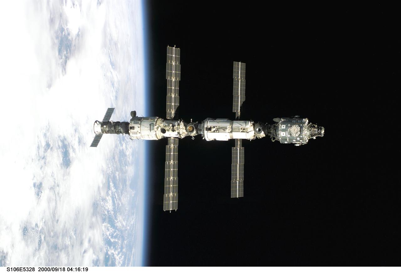 S106-E-5328 (18 September 2000) --- Backdropped against Earth's horizon, the International Space Station (ISS) is seen following its undocking with the Space Shuttle Atlantis. After accomplishing all mission objectives in outfitting the station for the first resident crew, the seven astronauts and cosmonauts undocked at 3:46 GMT on Sept. 18 over Russia near the northeastern portion of Ukraine. When Atlantis was at a safe distance from the station, about 450 feet, astronaut Scott D. Altman, pilot, performed a 90-minute, double-loop fly around to enable the crew to document the station’s exterior. He fired Atlantis’ jets one final time to separate from the station at 5:35 (GMT) September 18.