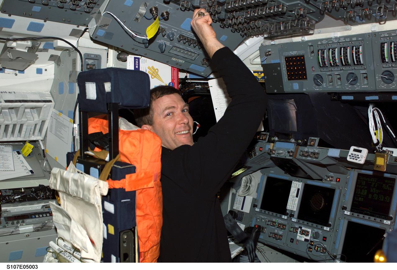 STS107-E-05003 (17 January 2003) --- Astronaut Rick D. Husband, STS-107 mission commander, occupies the commander&#0146;s station on the forward flight deck of the Earth-orbiting Space Shuttle Columbia.