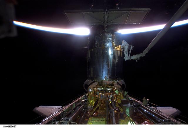 NASA image: EVA 2 - MS Newman and Massimino on HST during sunrise