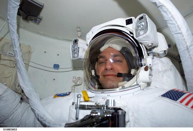 NASA image: MS Linnehan  wearing EMU in airlock prepares for EVA 3
