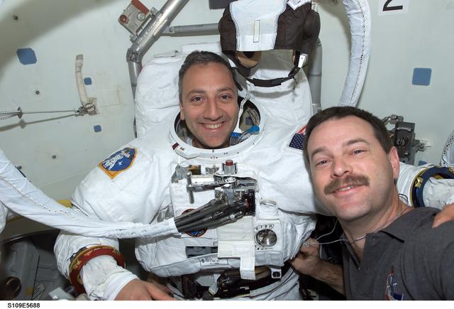 NASA image: CDR Altman and MS Massimino in airlock prior to  EVA 4
