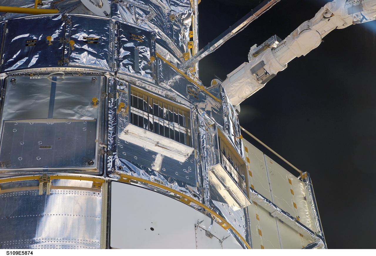 HST removed from payload bay by RMS arm