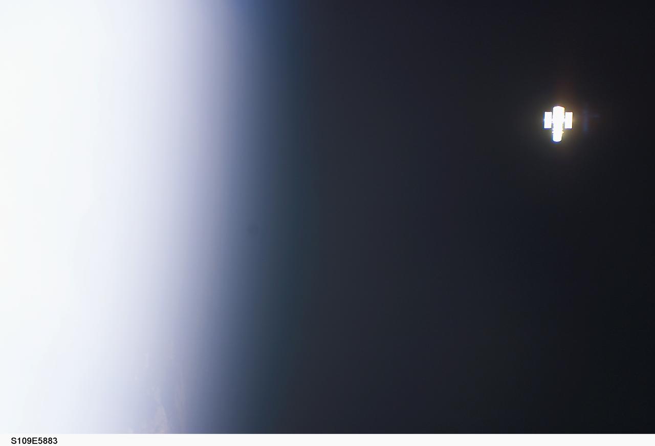 STS109-E-5883 (9 March 2002) --- The Hubble Space Telescope (HST) distances itself from the Space Shuttle Columbia  following its release on March 9, 2002.  Considering its original deployment in 1990 and three previous servicing missions, this marked the fifth time a shuttle has bade farewell to the giant telescope.  This image was recorded with a digital still camera.